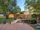 Landscaped backyard features a serene pond, a stone path, and a wooden deck at 6801 W 52Nd Ave, Arvada, CO 80002