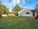 Expansive backyard boasts a well-maintained lawn and a cozy back porch at 6801 W 52Nd Ave, Arvada, CO 80002
