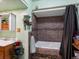 Relaxing bathroom with a soaking tub, tiled shower, and decorative accents at 6801 W 52Nd Ave, Arvada, CO 80002