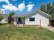 Charming single-story home with a well-maintained lawn and inviting front porch on a sunny day at 6801 W 52Nd Ave, Arvada, CO 80002
