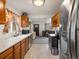 Efficient kitchen layout with updated appliances, ample counter space, and views of the living area at 6801 W 52Nd Ave, Arvada, CO 80002