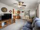 Inviting living room with TV, ceiling fan, and view of the kitchen at 6801 W 52Nd Ave, Arvada, CO 80002