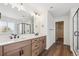 Elegant bathroom with double vanity, walk-in shower, and soaking tub at 1362 Zenith Heights Ct, Erie, CO 80516