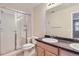 Bathroom featuring neutral tile, double sinks and glass enclosed shower at 2032 Spruce St, Denver, CO 80238