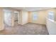 Bedroom with neutral carpet, trim, and paint with large windows for natural light at 2032 Spruce St, Denver, CO 80238