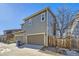 Exterior shot of a townhome showcasing a two-car garage, adjacent parking, and easy street access in a residential area at 2032 Spruce St, Denver, CO 80238