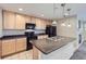 Kitchen featuring stainless steel appliances, an island, and hanging pendant lights at 2032 Spruce St, Denver, CO 80238