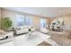 Bright living room features modern decor, large windows, and a sliding door to the outside at 2032 Spruce St, Denver, CO 80238