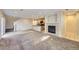 Open concept living area showcases kitchen, fireplace, and ample natural light at 2032 Spruce St, Denver, CO 80238
