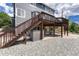 Backyard has a rock landscape with a concrete patio and a deck with stairs at 3630 Sawgrass Trl, Castle Rock, CO 80109