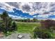 Scenic backyard with a lush lawn and blue skies above, perfect for outdoor enjoyment and relaxation at 3630 Sawgrass Trl, Castle Rock, CO 80109