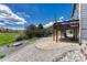 View of patio and deck with rock landscaping in a spacious backyard with string lights at 3630 Sawgrass Trl, Castle Rock, CO 80109