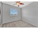 Cozy bedroom with neutral carpet, ceiling fan, window with blinds and closet at 3630 Sawgrass Trl, Castle Rock, CO 80109