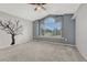 Inviting bedroom with vaulted ceilings, tree wall art, and large windows at 3630 Sawgrass Trl, Castle Rock, CO 80109