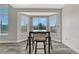 Cozy breakfast nook with a bay window offering scenic views and a sleek table set for casual dining at 3630 Sawgrass Trl, Castle Rock, CO 80109