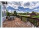 Spacious wooden deck with outdoor seating and a beautiful view of the surrounding landscape at 3630 Sawgrass Trl, Castle Rock, CO 80109