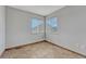Empty room with neutral tile flooring and bright windows, offering versatile space at 3630 Sawgrass Trl, Castle Rock, CO 80109
