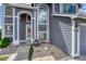 Well-maintained front entrance, enhanced with sand and stone garden, inviting curb appeal at 3630 Sawgrass Trl, Castle Rock, CO 80109