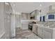 Updated kitchen with gray cabinets, stainless steel appliances, and stylish backsplash at 3630 Sawgrass Trl, Castle Rock, CO 80109