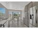 Bright kitchen area with gray cabinets, stainless appliances, and breakfast nook with bay windows at 3630 Sawgrass Trl, Castle Rock, CO 80109