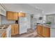 A charming kitchen featuring wood cabinets, laminate counters, and stainless steel appliances at 3630 Sawgrass Trl, Castle Rock, CO 80109