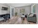 Comfortable living room with hard surface floors, gray sofa, and desk at 3630 Sawgrass Trl, Castle Rock, CO 80109