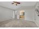View of main bedroom with vaulted ceilings, connecting bathroom, and neutral carpet at 3630 Sawgrass Trl, Castle Rock, CO 80109