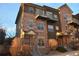 Attractive three-story townhome with stone accents and a balcony at 18766 E Yale Cir # A, Aurora, CO 80013