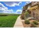 Townhome exterior with front yard, covered entry and low maintenance landscaping at 18766 E Yale Cir # A, Aurora, CO 80013