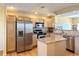 Modern kitchen featuring stainless steel appliances and ample cabinet space at 18766 E Yale Cir # A, Aurora, CO 80013