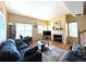 Cozy living room with a fireplace, comfortable seating, and natural light at 18766 E Yale Cir # A, Aurora, CO 80013