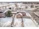 Aerial view of home in a quiet neighborhood with fully fenced backyard at 225 Longspur Dr, Brighton, CO 80601