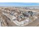 Aerial view of home in a quiet neighborhood with landscaped yards and convenient street parking at 225 Longspur Dr, Brighton, CO 80601