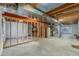 Unfinished basement with exposed beams and new utilities at 225 Longspur Dr, Brighton, CO 80601