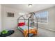 Playful bedroom featuring a unique bed frame and natural light at 225 Longspur Dr, Brighton, CO 80601