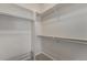 Spacious walk-in closet with shelving and rods for optimal storage at 225 Longspur Dr, Brighton, CO 80601