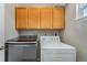 Convenient laundry room with modern washer and dryer units at 225 Longspur Dr, Brighton, CO 80601