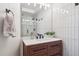 Modern bathroom with sleek vanity, stylish fixtures, and a glass-enclosed shower at 31607 Broadmoor Dr, Evergreen, CO 80439