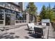 Expansive outdoor deck includes ample seating, a spa, and seamless indoor-outdoor flow at 31607 Broadmoor Dr, Evergreen, CO 80439