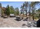 Inviting outdoor living space with a relaxing hot tub, lounge seating, and scenic natural views at 31607 Broadmoor Dr, Evergreen, CO 80439