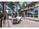 Spacious deck features patio furniture and a tranquil view of the surrounding lush forest landscape at 31607 Broadmoor Dr, Evergreen, CO 80439
