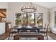 Bright dining room with a large window offering stunning views of the surrounding landscape at 31607 Broadmoor Dr, Evergreen, CO 80439
