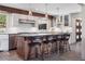Spacious kitchen with a large island, stainless steel appliances, and custom cabinetry at 31607 Broadmoor Dr, Evergreen, CO 80439