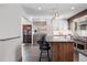 Open kitchen featuring an island with seating and stainless steel appliances at 31607 Broadmoor Dr, Evergreen, CO 80439