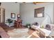 Spacious living room featuring hardwood floors, a sitting area and a high ceiling at 31607 Broadmoor Dr, Evergreen, CO 80439