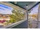 Relaxing balcony with views of surrounding trees and neighborhood, perfect for outdoor enjoyment at 11109 Alcott St # D, Westminster, CO 80234