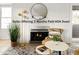 Inviting living room features a fireplace, modern lighting, and stylish decor, creating a warm and comfortable atmosphere at 11109 Alcott St # D, Westminster, CO 80234
