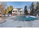 Community pool with winter cover and adjacent clubhouse at 11109 Alcott St # D, Westminster, CO 80234