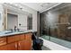 Bathroom with dark stone vanity and tub at 601 W 11Th Ave # 109, Denver, CO 80204