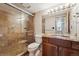 Bathroom with granite vanity and shower at 601 W 11Th Ave # 109, Denver, CO 80204